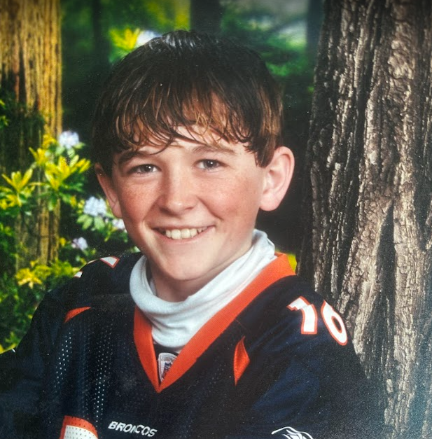 Aaron in his Denver Broncos jersey as a boy